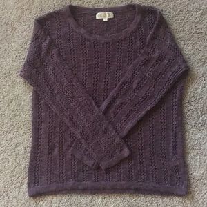 Breezy, dark purple sweater.